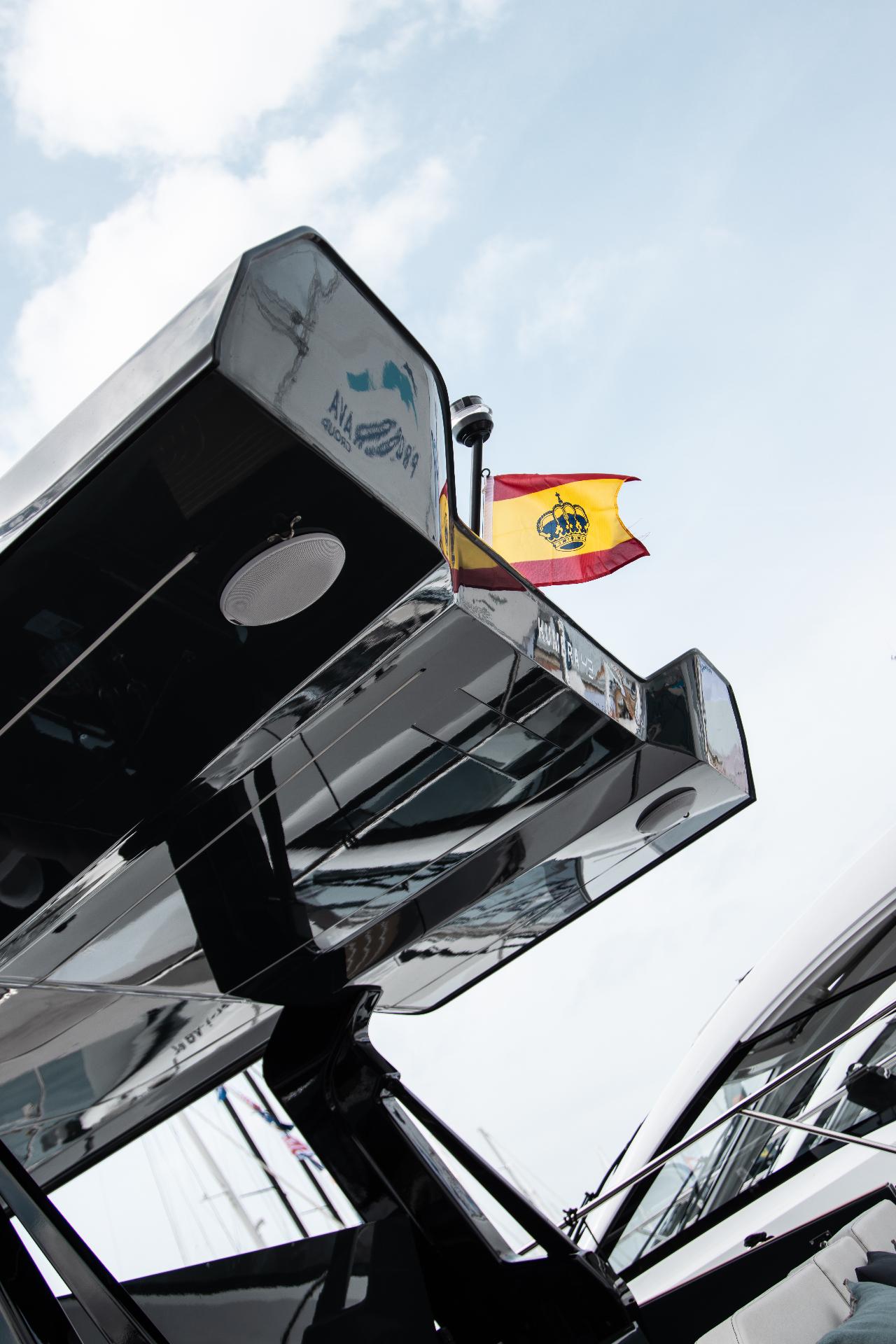 Polished reflections. Steel, chrome and waving flag.