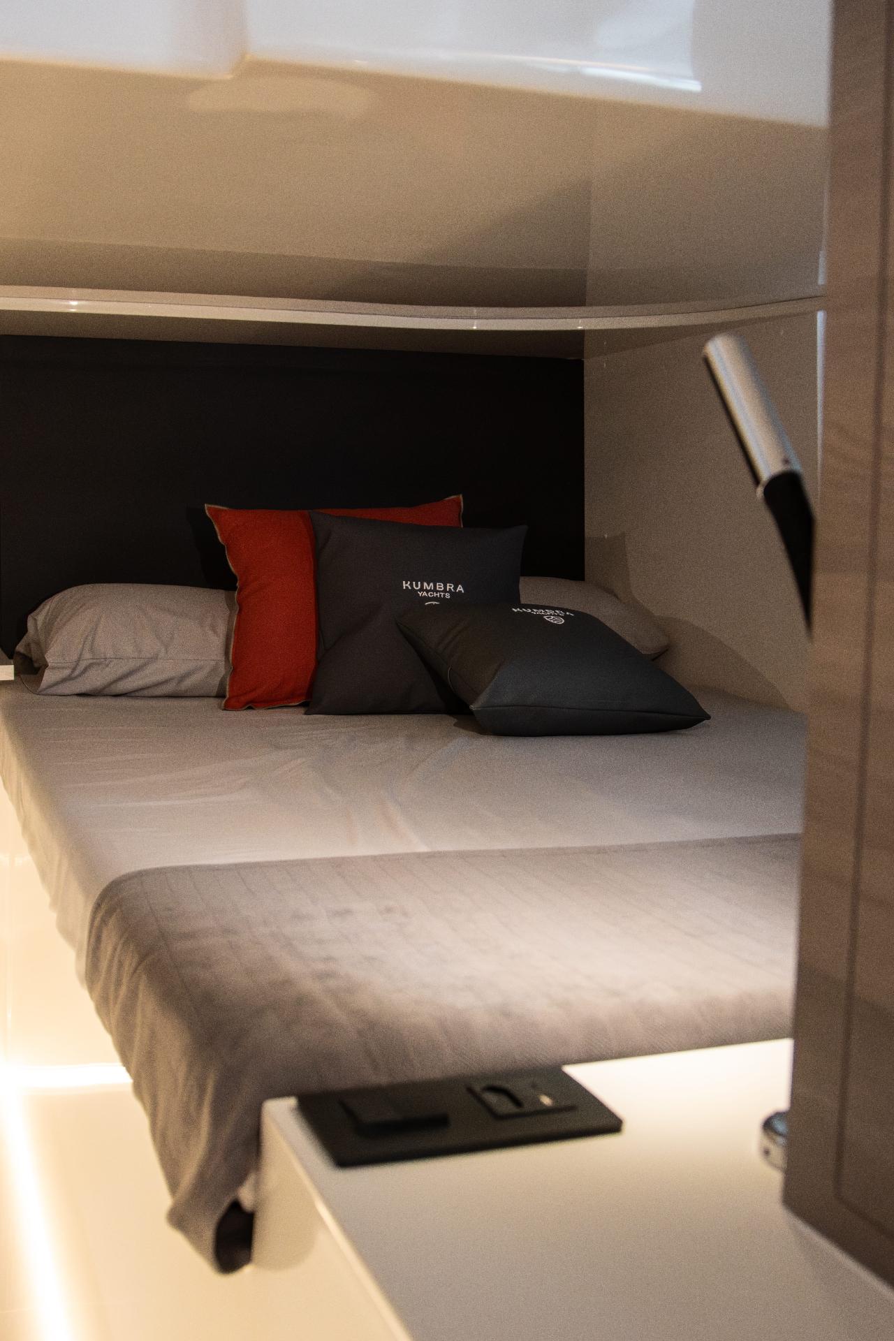 Guest cabin with double bed and premium finishes.